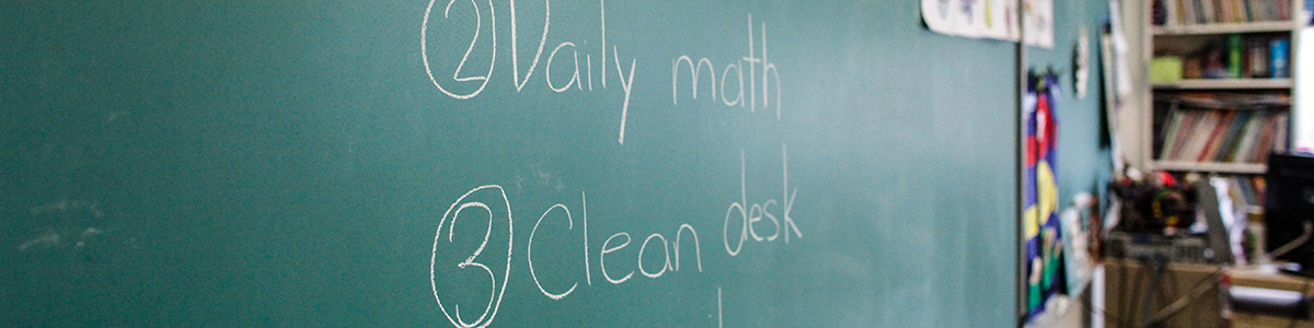 Elementary classroom chalkboard with day's schedule on board